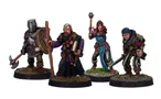 A group of four detailed miniatures representing classic adventurer character classes. On the left, a knight in armor holds a shield, followed by a robed figure with a book and staff. The third figure is a female illusionist in a blue dress with a staff, and on the right, a rugged fighter brandishes a sword. Each miniature is mounted on a round base with grass detailing.