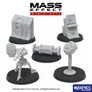 Five unpainted resin miniatures from the Mass Effect universe are displayed on black bases. The set includes a tall, rectangular wall piece, a control panel with intricate details, a cylindrical object resembling a power core, a small turret-like figure, and a spherical device on a stand. All miniatures are in a light gray color, showcasing their design features without any paint. The Mass Effect logo is prominently featured at the top of the image, along with the Modiphius Entertainment branding at the bottom.