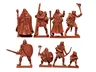 A collection of eight fantasy miniatures is displayed, sculpted in a reddish-brown material. The figures include a male wizard with a staff, a male cleric, a male fighter, a male half-elf thief, a male elf ranger, a male halfling thief, and a male human henchman, all depicted in dynamic poses. Each miniature is designed to be 28mm in scale, showcasing a variety of armor and weapons, suitable for a typical fantasy RPG party.