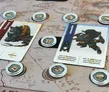 Board game with cards, tokens, and a map background.