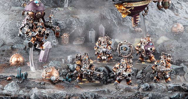 A group of Kharadron Overlords, depicted as flying dwarves in intricate nullsuits, stands on a rocky terrain. They are equipped with various steampunk-inspired weapons and gadgets, showcasing a mix of bronze and metallic colors. In the background, an airship hovers above, adding to the adventurous atmosphere of the scene.