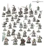 A diverse array of miniatures showcases a new faction from Age of Sigmar, featuring the Helsmiths of Hashut, alongside the Deathrattle Tomb Host and Snarlpack Huntaz. The image displays numerous figures, including skeletal warriors, mounted knights, and various characters, all intricately detailed and posed on round bases. The color palette includes muted tones with metallic accents, emphasizing the grimdark aesthetic typical of the Warhammer universe.