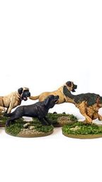 A collection of miniature dogs in various poses, including several tan and black dogs, is displayed on grassy bases. In the background, a mounted Roman general in ornate armor and a colorful plume rides a horse, adding a historical element to the scene. The dogs appear to be interacting with each other, creating a lively atmosphere around the general.