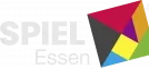 A colorful logo for Spiel Essen features the word "SPIEL" in bold, white letters, with "Essen" in a smaller font below. Accompanying the text is a geometric design made up of overlapping shapes in red, yellow, green, and black, creating a dynamic and playful visual. The overall design conveys a sense of excitement and creativity, reflecting the spirit of the board game convention.