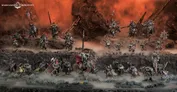 Miniature figures depicting a battle scene with armored warriors in dark blue and red armor, wielding spears, swords, and shields. One figure holds a large banner with a white skull symbol.
