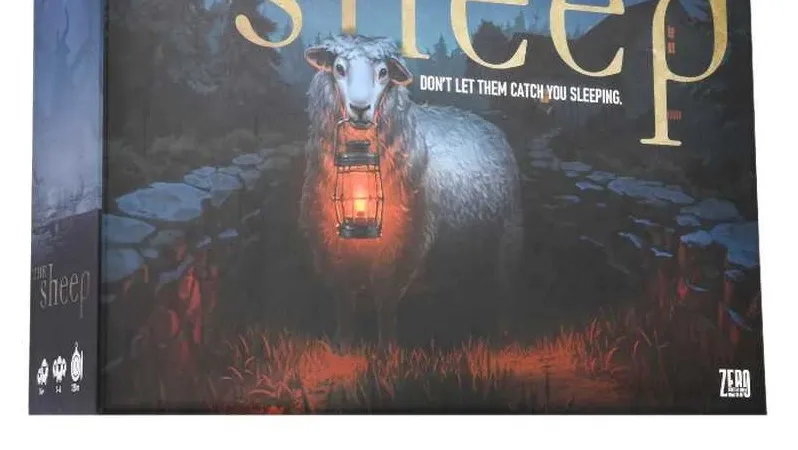 A board game box titled "The Sheep" features a menacing sheep holding a lantern, set against a dark, eerie forest backdrop. The title is prominently displayed in gold lettering, with the tagline "DON'T LET THEM CATCH YOU SLEEPING" beneath it. The overall color scheme is dark, with shades of blue and green, enhancing the horror-comedy theme of the game.