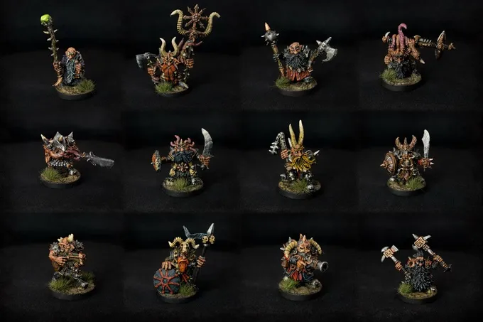 A grid of 12 painted miniature figures against a black background. Each figure depicts a Chaos Dwarf warrior with detailed armor, weapons, and some with horns or helmets. Weapons include axes, hammers, spears, and swords. Some figures have shields or decorative elements like animal skulls and spikes. The bases are textured with green to resemble grass.