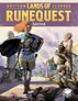 Cover art for Lands of RuneQuest: Sartar. Central figure with red hair, armor, and a blue cloak stands holding a shield with a rune design. Behind, an elderly man in robes and a warrior with spear. Title reads "LANDS OF RUNEQUEST Sartar" with ancient symbols above.