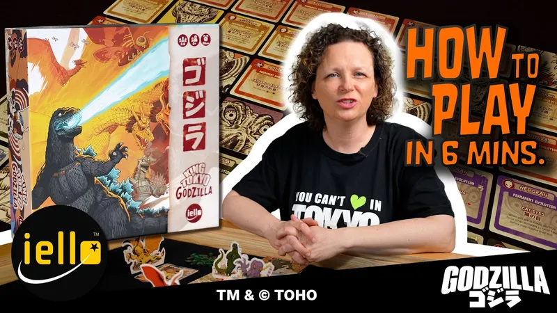 A woman with curly hair is seated in the foreground, wearing a black t-shirt that reads "YOU CAN'T ♥ IN TOKYO." Behind her, a colorful array of game cards is visible, featuring various designs and symbols related to the game. The box for "King of Tokyo Godzilla" is positioned to the left, and the text "HOW TO PLAY IN 6 MINUTES" is prominently displayed above her.