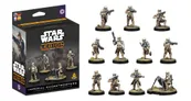 A box for the "Imperial Shoretroopers" expansion for Star Wars: Legion is prominently displayed, featuring a striking design with the Star Wars logo and the Imperial insignia. The box showcases images of several Shoretrooper miniatures, including one equipped with a mortar, all posed on scenic bases. The packaging includes multilingual text and symbols indicating the contents, emphasizing the new release's updated cards and packaging format.