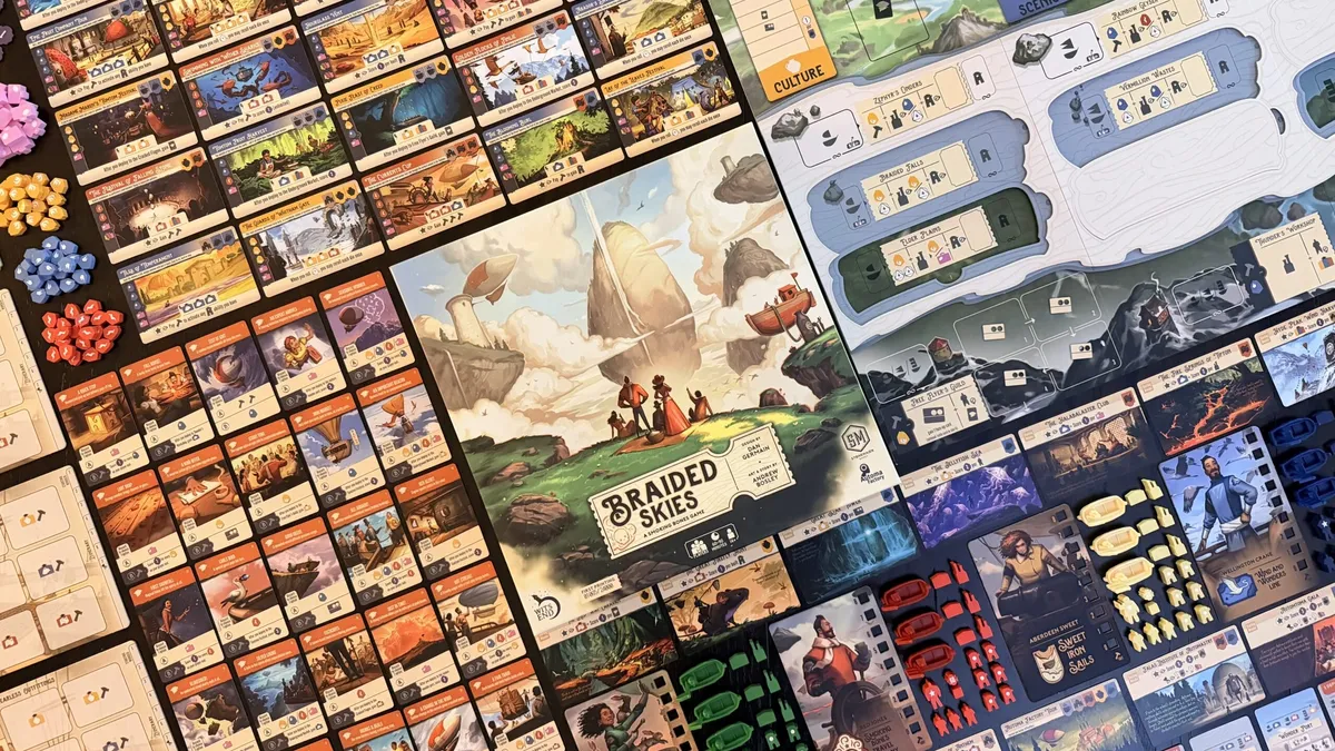 Braided Skies game board with cards and components spread out.