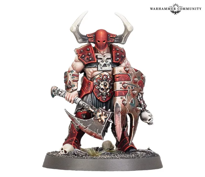 A muscular warrior stands prominently, adorned in red and black armor with sharp spikes and skull motifs. He wields a large, menacing axe in one hand and a shield with jagged edges in the other, both showcasing intricate detailing. His head is covered by a horned helmet, and he stands on a rocky base with sparse grass and skulls scattered around.