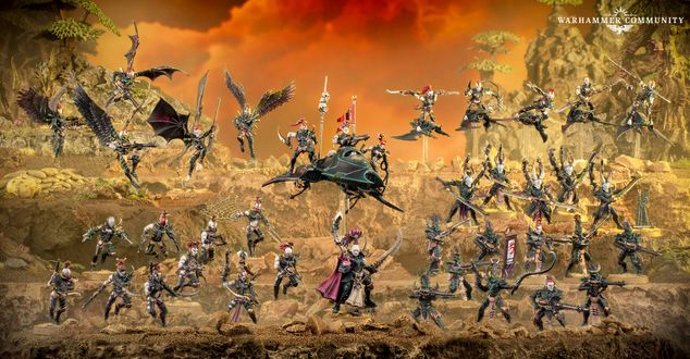 A dynamic display of Drukhari miniatures showcases a variety of figures, including the prominent Archon Lady Malys in the foreground, wielding a barbed longsword. Surrounding her are several lethal lieutenants and warriors, each adorned with intricate armor and weapons, set against a dramatic backdrop of rocky terrain and a fiery sky. The scene captures the essence of the Drukhari's dark and menacing aesthetic, highlighting their agility and deadly prowess in battle.