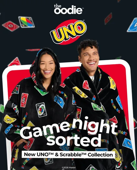 Two people in UNO-themed hooded blankets, with UNO logo and cards in background. Text: "Game night sorted"
