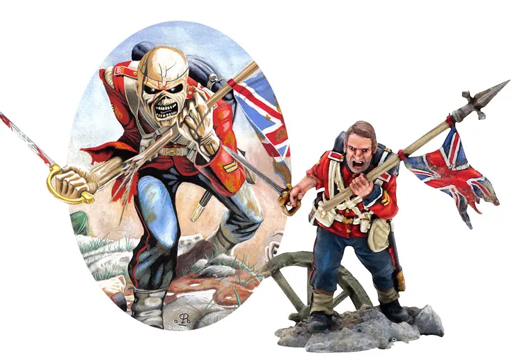 A detailed miniature of a British soldier from the Crimean War stands prominently on the right, holding a spear and a Union Jack flag, with an intense expression. To the left, an illustration features a skeletal figure in a red uniform, also holding a spear and displaying a similar flag, set against a backdrop of a battlefield. The soldier is positioned on a rocky base, while the illustration is framed in an oval shape.