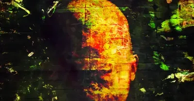 Distorted, glowing face silhouette in dark, abstract background. Overlaid text reads: "ID//eNtiTY unknown."