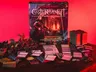 Castle Ravenloft Board Game box, miniatures, cards, and tokens on a table.