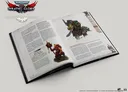 An open book titled "Adventures in Gilead" from the Warhammer 40,000 Roleplay: Wrath & Glory collection displays detailed text and illustrations. On the left page, sections titled "Imperium Framework" and "Ork Framework" are visible, along with a small box labeled "Missions and Loyalty Missions." The right page features an illustration of an Ork Kommando, depicted as a muscular green-skinned character wielding a weapon. The overall design is dark and thematic, reflecting the grim atmosphere of the Warhammer universe.