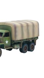 A green and brown camouflaged American Studebaker truck is positioned on the left, featuring a covered cargo area and a white star insignia on its side. Next to it, on the right, is a tan Autoblinda AB41 armored car, showcasing a rounded body and a turret, with a slightly weathered appearance. Both vehicles are detailed models suitable for tabletop gaming, reflecting their historical designs from WWII.