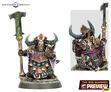 A detailed miniature of a Zharrdron warrior stands prominently, showcasing intricate armor adorned with spikes and dark metallic hues. The figure wields a large, ornate staff topped with a green, glowing emblem, and features a helmet with prominent horns, emphasizing its imposing presence. The base is textured with rocky elements, enhancing the character's fierce and industrial aesthetic.