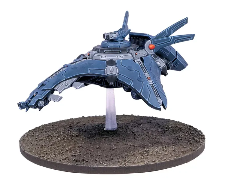 A sleek, futuristic spacecraft is depicted, featuring a predominantly blue body with intricate detailing and a prominent turret on top. It is mounted on a clear stand, giving the impression of flight above a textured, circular base that resembles barren terrain. The design includes sharp angles and fins, emphasizing its advanced technology and sci-fi aesthetic.