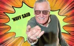 A man with gray hair and sunglasses points directly at the viewer, wearing a gray sweater over a collared shirt. The background features a vibrant comic-style explosion in bright yellow and green, with the text "'NUFF SAID" prominently displayed. The overall composition conveys a dynamic and enthusiastic tone, reminiscent of classic comic book art.