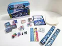 Burgle Bros. 3 Future Flip game box, cards, dice, tokens, rulebook, and components on a white surface.