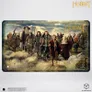 Group of dwarves and Bilbo in a grassy field, "The Hobbit" text above.