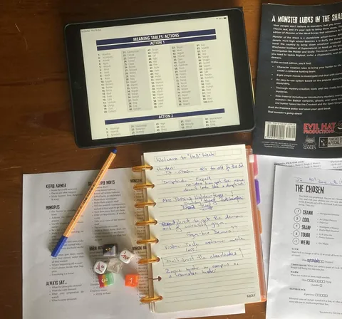 Topdown photo of a solo game in progress. Roll table from Mythic on tablet, Monster of the Week rulebook, journal for note taking, reference sheets