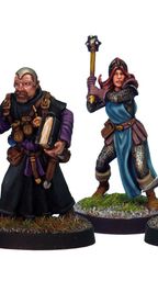 A group of four detailed miniatures representing classic adventurer character classes. On the left, a knight in armor holds a shield, followed by a robed figure with a book and staff. The third figure is a female illusionist in a blue dress with a staff, and on the right, a rugged fighter brandishes a sword. Each miniature is mounted on a round base with grass detailing.