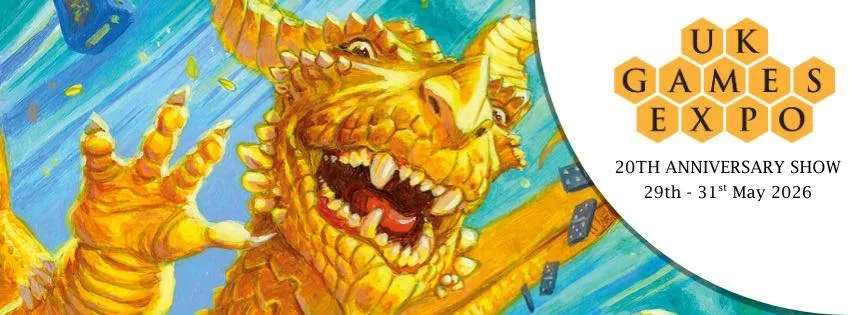 A vibrant illustration features a large, golden dragon with a playful expression, showcasing its sharp teeth and prominent features. The dragon is surrounded by a blue background with scattered game dice, emphasizing a whimsical and dynamic atmosphere. The UK Games Expo logo is prominently displayed in the corner, indicating the event's 20th anniversary from May 29th to 31st, 2026.