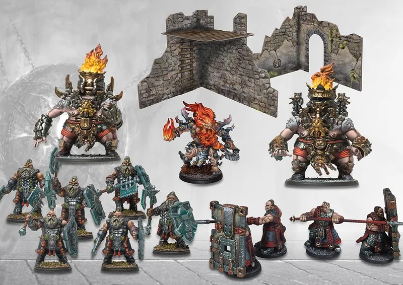 Miniature warriors, stone ruins, and flaming braziers on a gray surface.