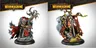 The image features two intricately designed miniatures from the Warmachine Khador Old Umbrey Auxiliary Expansion. On the left, a figure with a skeletal, branch-like appearance holds a staff, adorned with various textures and details. On the right, a witch, Olesea Reznikova, is depicted in a dynamic pose, wearing a mix of armor and flowing garments, with a serpent coiling around her arm and a dramatic backdrop of fur and foliage. Both miniatures are set against a light gradient background, emphasizing their detailed craftsmanship.