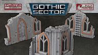 Two pieces of Gothic Sector terrain are displayed, featuring ruined structures with a weathered stone appearance. Each piece has arched windows and doors, accented with orange detailing, showcasing a mix of gray tones and visible wear. The terrain is designed for 28-35mm scale tabletop games, emphasizing its pre-painted, ready-to-use quality.