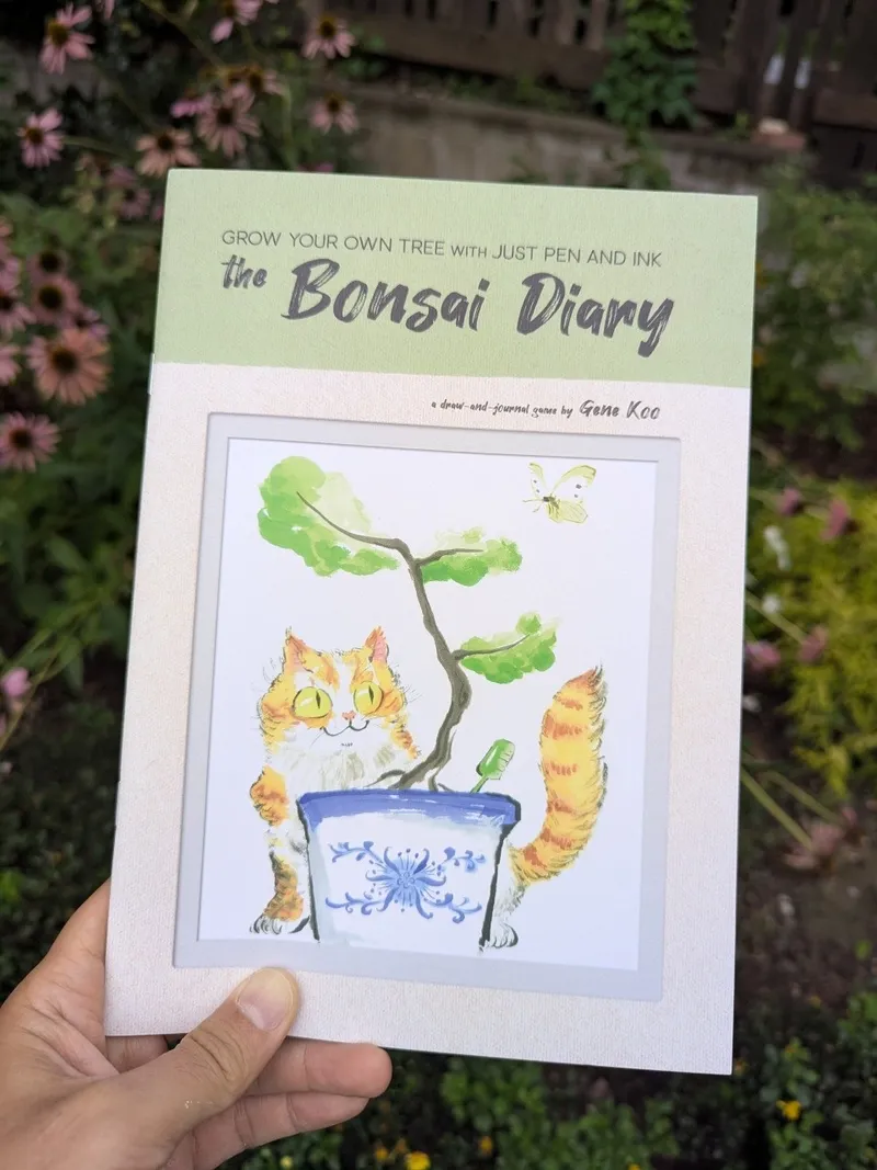 Book cover: "the Bonsai Diary" with illustrated cat in a pot, tree, and butterfly.