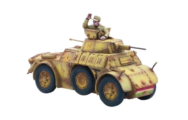 A detailed model of a military vehicle, featuring a tan and brown camouflage pattern with weathering effects. The vehicle has large, rugged wheels and is equipped with two visible cannons on the turret. A figure of a soldier in a uniform and cap is positioned on top, waving, adding a dynamic element to the scene.