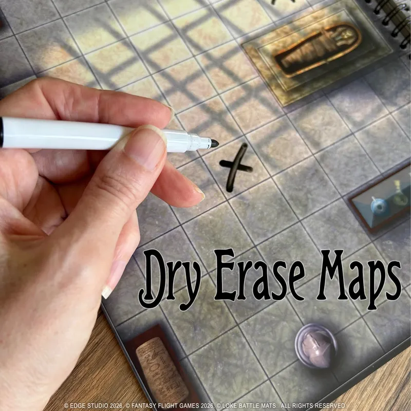 Hand marking an X on a tiled map with "Dry Erase Maps" text.