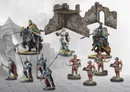 Miniature warriors and a stone ruin with a wooden platform.