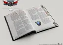 An open book titled "Adventures in Gilead" from the Warhammer 40,000 Roleplay: Wrath & Glory series displays pages filled with text and headings. The left page features sections titled "The Wreckage of Our World" and "Navigating Through the Ruins of Ul-Khari," while the right page includes "Frozen Predators," "The Dying Jungle," and other headings. A decorative emblem with a blue gem and green accents is positioned at the bottom right corner of the right page, enhancing the thematic design of the publication.