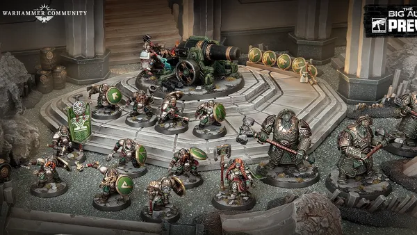 Miniature figures of armored duardin warriors in green and silver plate, standing on a rocky battlefield. One figure holds a large green banner with a white circular emblem. A cannon with a crew of two figures is positioned on a raised platform.
