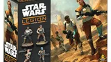 Boxed Star Wars: Legion set labeled "Guerrilla Troopers." Features seven miniatures: two standing female troopers in desert gear, one holding a rifle; five smaller figures in varied poses, some with weapons. Background shows rocky terrain with distant structures.