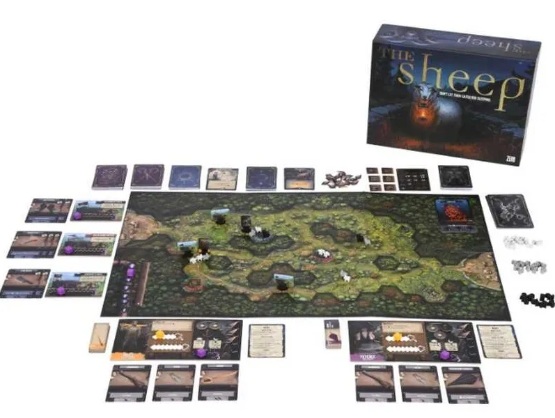 A tabletop game setup for "The Sheep" features a large game board depicting a winding path through a dark, forested landscape, with hexagonal spaces representing different terrains. Various game components are arranged around the board, including character cards, equipment cards, and tokens, with several miniatures representing Shepherds and mutant sheep positioned on the board. The game box is visible in the upper right corner, showcasing an ominous sheep with glowing eyes, emphasizing the horror-comedy theme of the game.