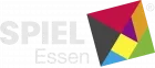 A colorful logo for Spiel Essen features the word "SPIEL" in bold, white letters, with "Essen" in a smaller font below. Accompanying the text is a geometric design made up of overlapping shapes in red, yellow, green, and black, creating a dynamic and playful visual. The overall design conveys a sense of excitement and creativity, reflecting the spirit of the board game convention.