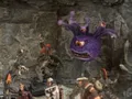 A collection of fantasy miniatures features several lizardmen, one wielding a shield and weapon, and another with a torch, set against a rocky backdrop. In the background, a large, purple creature with multiple eyes and a menacing expression looms, adding to the scene's fantastical atmosphere. A female character in dark robes stands nearby, while other figures in armor are partially visible, enhancing the sense of adventure.