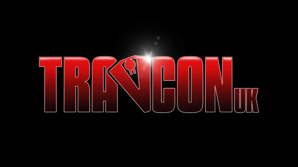 The image features the logo for "Travcon," prominently displayed in bold, red letters against a black background. The "TRA" portion of the logo is stylized, with a key symbol integrated into the letter "V," adding a unique touch. The overall design conveys a sense of excitement and adventure, fitting for a convention dedicated to the Science Fiction RPG game, Traveller.