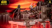 A dynamic scene features a duel between Darth Vader and Ahsoka Tano, set on the desolate world of Malachor. Ahsoka, wielding two blue lightsabers, is depicted in an action pose, while Darth Vader stands menacingly, showcasing his iconic black armor. The background includes rugged rock formations and a futuristic control panel, with a dramatic orange and red sky enhancing the intensity of the confrontation.