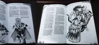 Open book spread displaying two pages of a tabletop roleplaying game supplement. The left page features a large black-and-white illustration of a robed, skeletal figure with exaggerated facial features, holding a small child wrapped in cloth. The figure wears a wide-brimmed hat and has tattered, wing-like fabric draped over its shoulders. Below the illustration, a section of body text begins with the heading "Then, the Postman/Gravedigger and the two lead to finding the party."

The right page contains dense body text, including a section titled "The End of the Road" and another titled "The Ritual of the Board." At the bottom of the right page, the year "2023" and the publisher "ND Hobbies" are printed. The text is formatted in two columns with a serif font.
