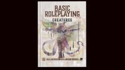 A hardcover book titled "Basic Roleplaying: Creatures" features an intricate cover illustration of a fantastical creature with a mix of human and animal traits, holding a trident. The creature has colorful wings and a detailed, textured body, set against a muted background with abstract patterns. The authors' names, Neil Robinson and Jason Durall, are displayed at the bottom of the cover.