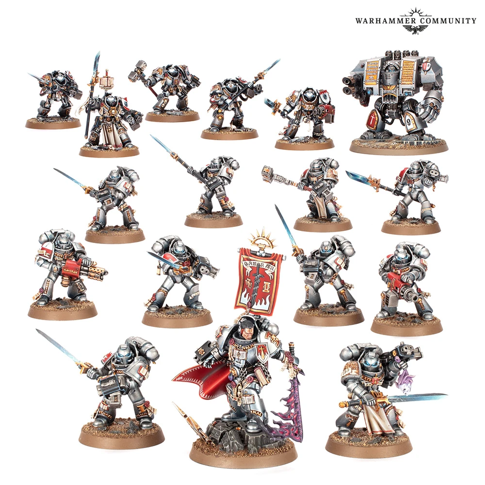 A collection of 15 miniature figures from the Warhammer 40,000 universe, showcasing the Black Templars and Grey Knights. The front center features a prominent character in ornate armor, holding a banner, flanked by various warriors equipped with swords, guns, and other weapons. The figures are painted in a mix of silver, black, and red, with intricate details highlighting their armor and weaponry, set against a simple brown base.