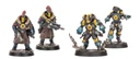 Three detailed miniatures from the Palanite Enforcer Captains & Sergeants set are displayed. The two figures on the left are heavily armored, wearing long coats with fur collars, and feature distinctive helmets with yellow visors and red mohawks. They are equipped with various weapons, including a large firearm, while the figure on the right appears to be a smaller character, possibly a cyber-mastiff, with a more intricate design. The bases of the miniatures are textured, enhancing their dynamic presentation.